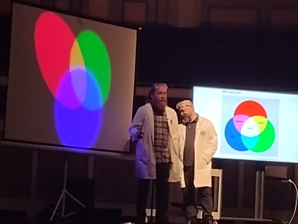 Doctor Rob and Doctor Brian demonstrate components of white light.
